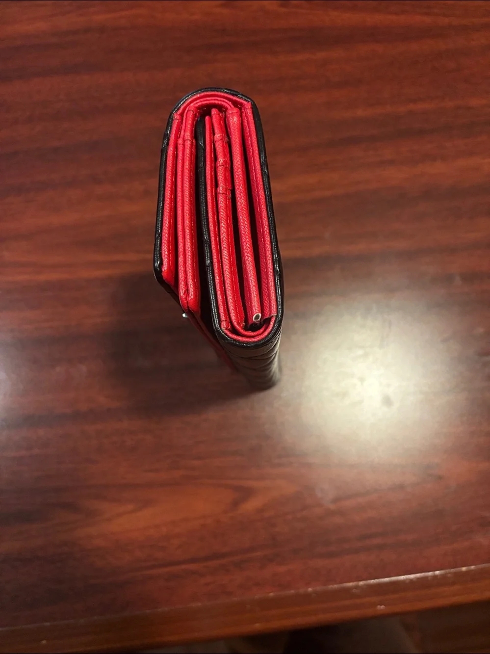 CHANEL Black Quilted Leather Wallet with Red Trim